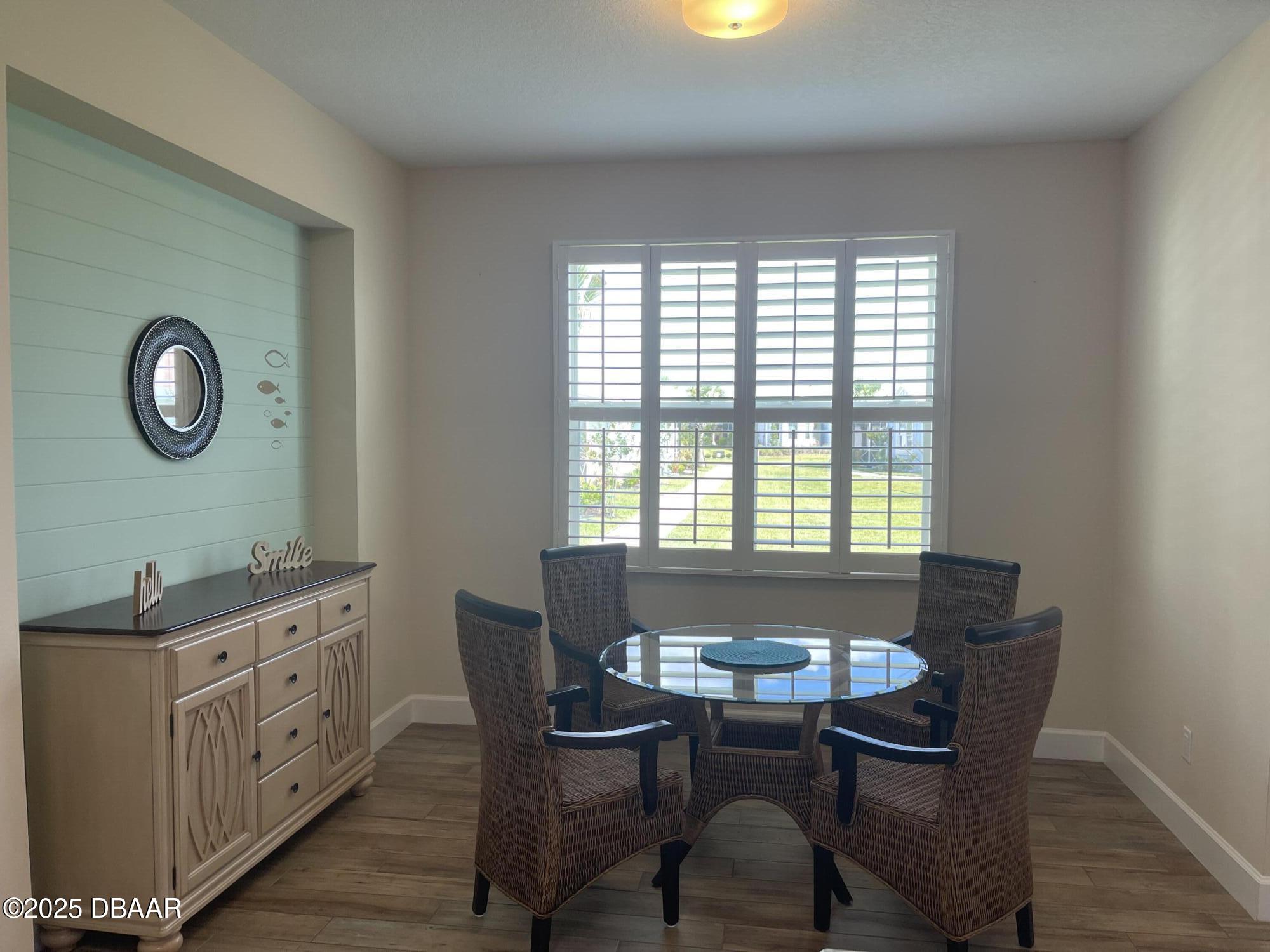 231 Ocean Hammock Loop Daytona Beach, FL 32124 - Photo 11 of 39 a dining room with furniture and window
