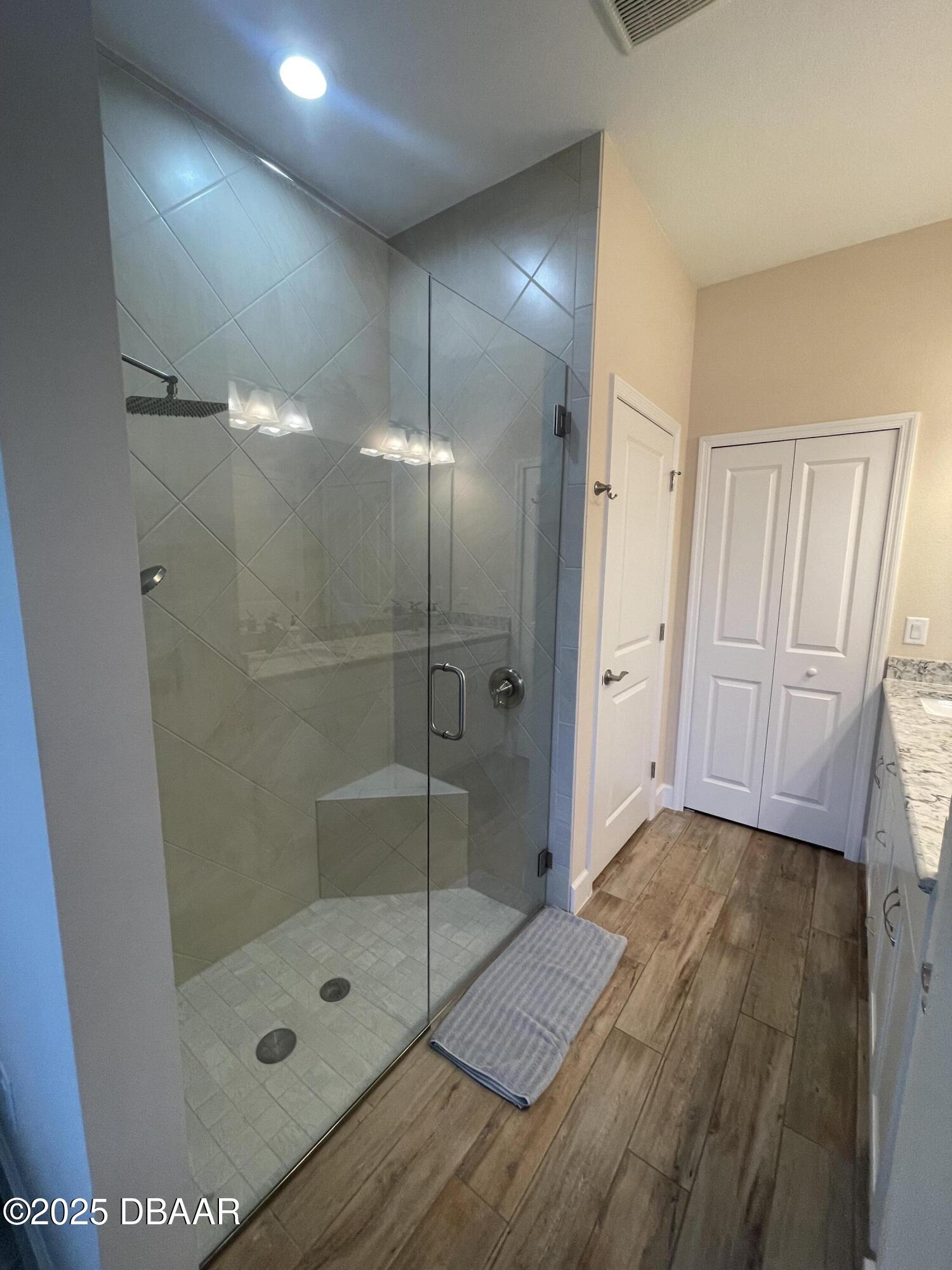 231 Ocean Hammock Loop Daytona Beach, FL 32124 - Photo 14 of 39 a bathroom with a shower and a mirror