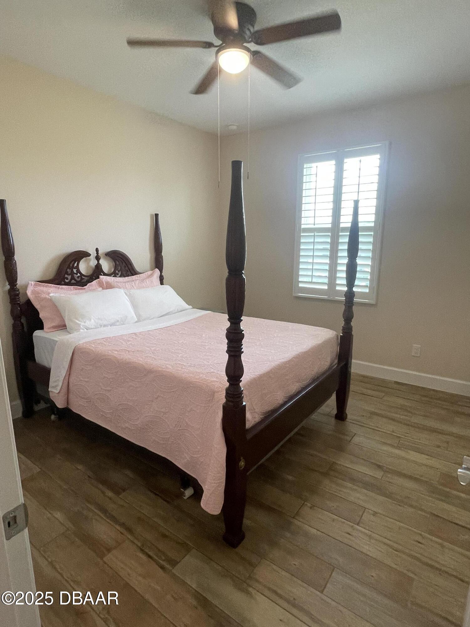 231 Ocean Hammock Loop Daytona Beach, FL 32124 - Photo 19 of 39 a bedroom with a bed and window