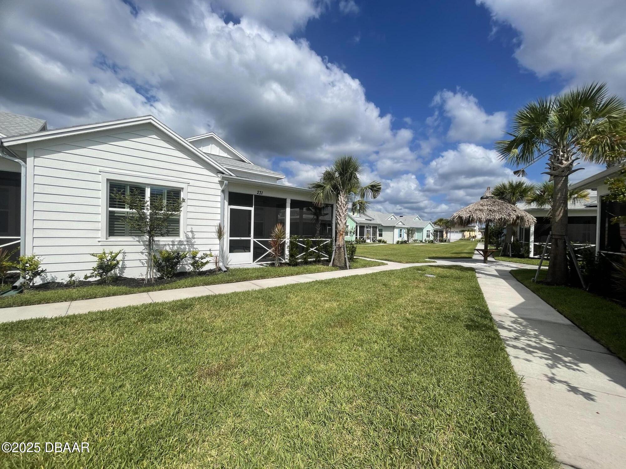 231 Ocean Hammock Loop Daytona Beach, FL 32124 - Photo 2 of 39 a view of a house with a back yard