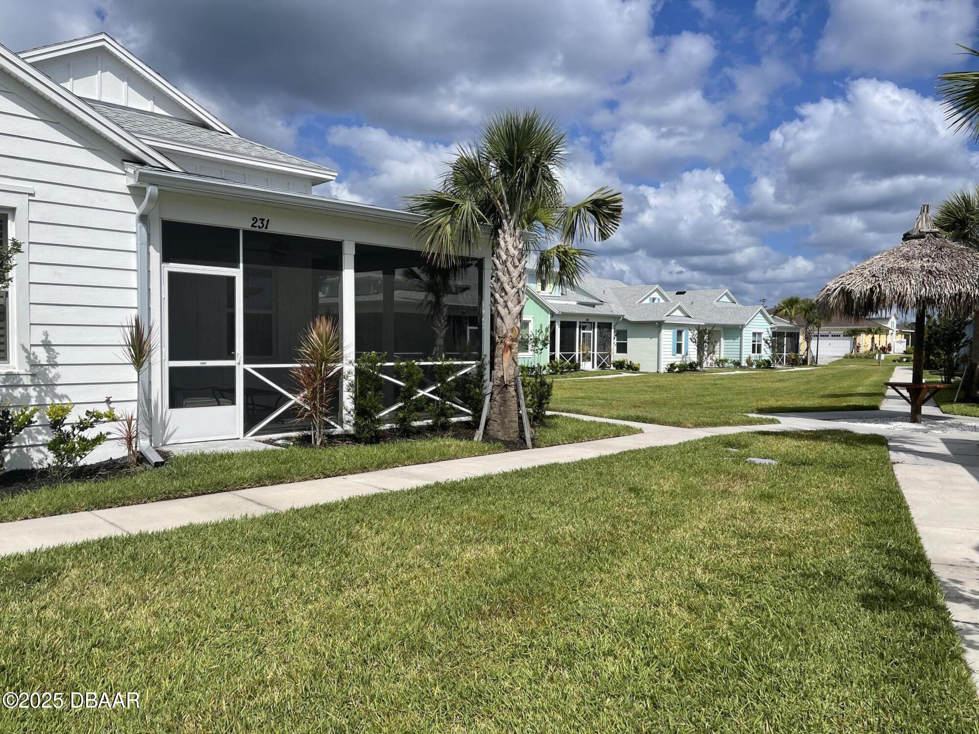 231 Ocean Hammock Loop Daytona Beach, FL 32124 - Photo 3 of 39 a view of a house with backyard and porch
