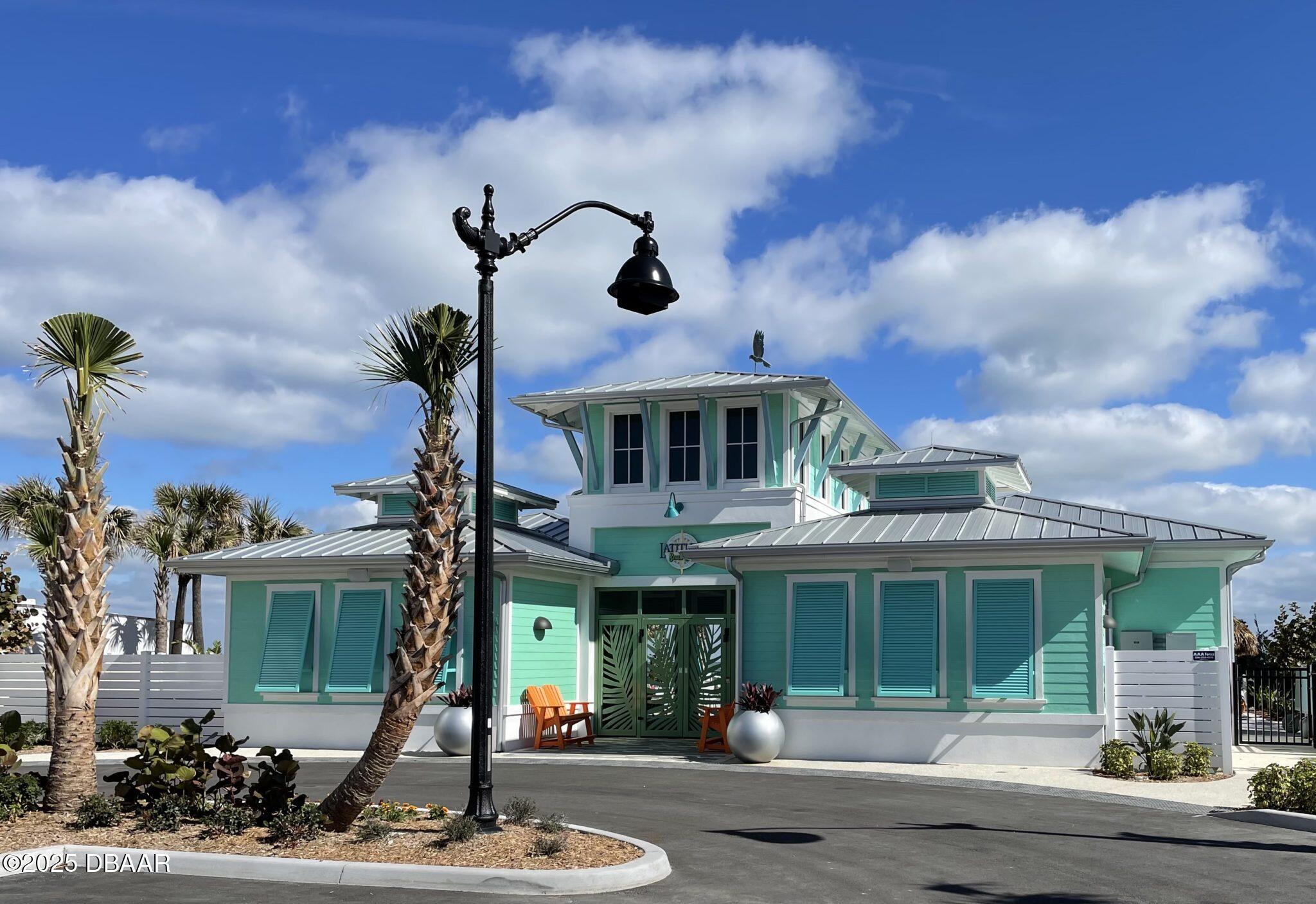 231 Ocean Hammock Loop Daytona Beach, FL 32124 - Photo 35 of 39 a front view of a house with garden