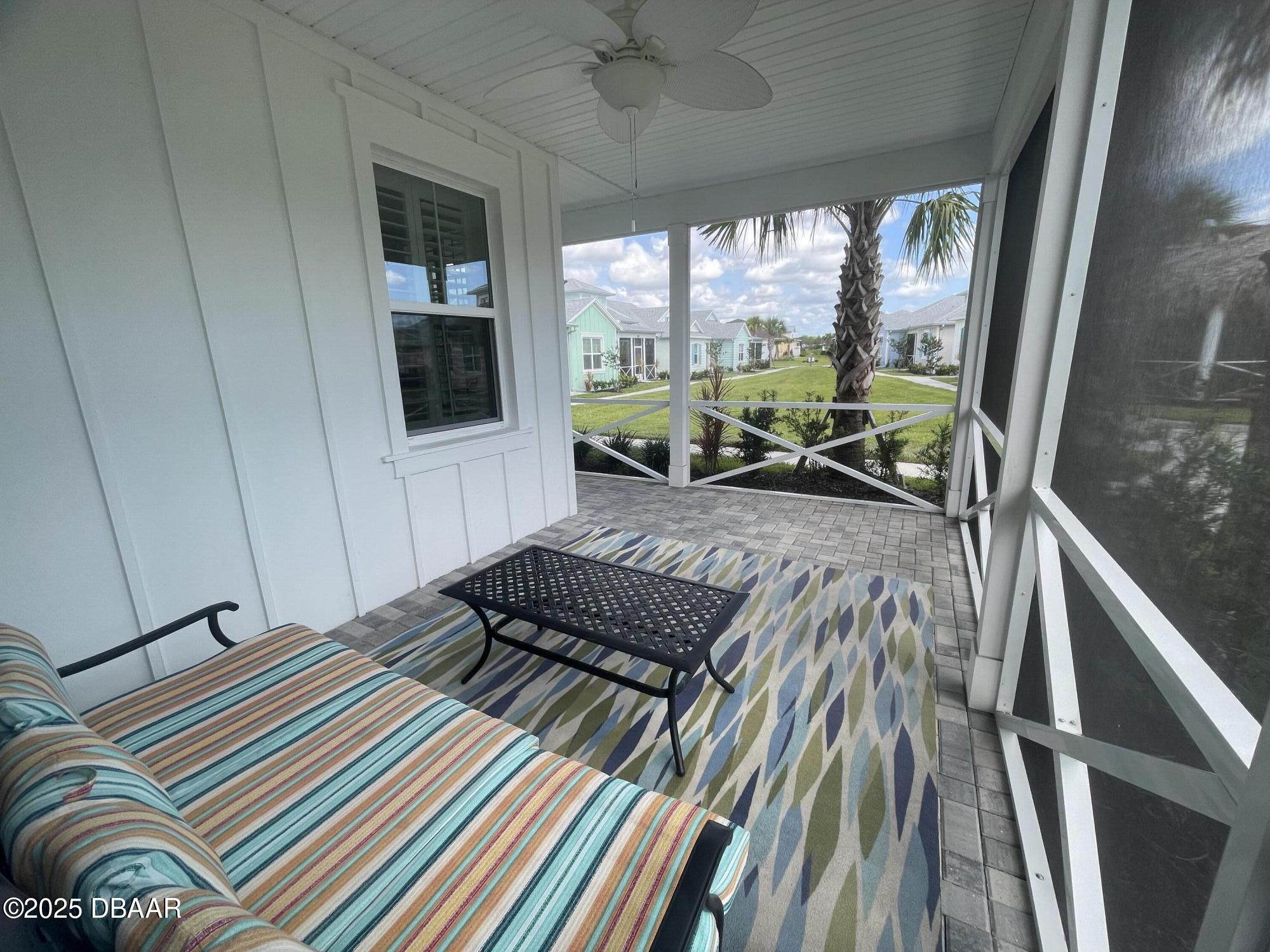 231 Ocean Hammock Loop Daytona Beach, FL 32124 - Photo 4 of 39 a bedroom with a bed and a large window