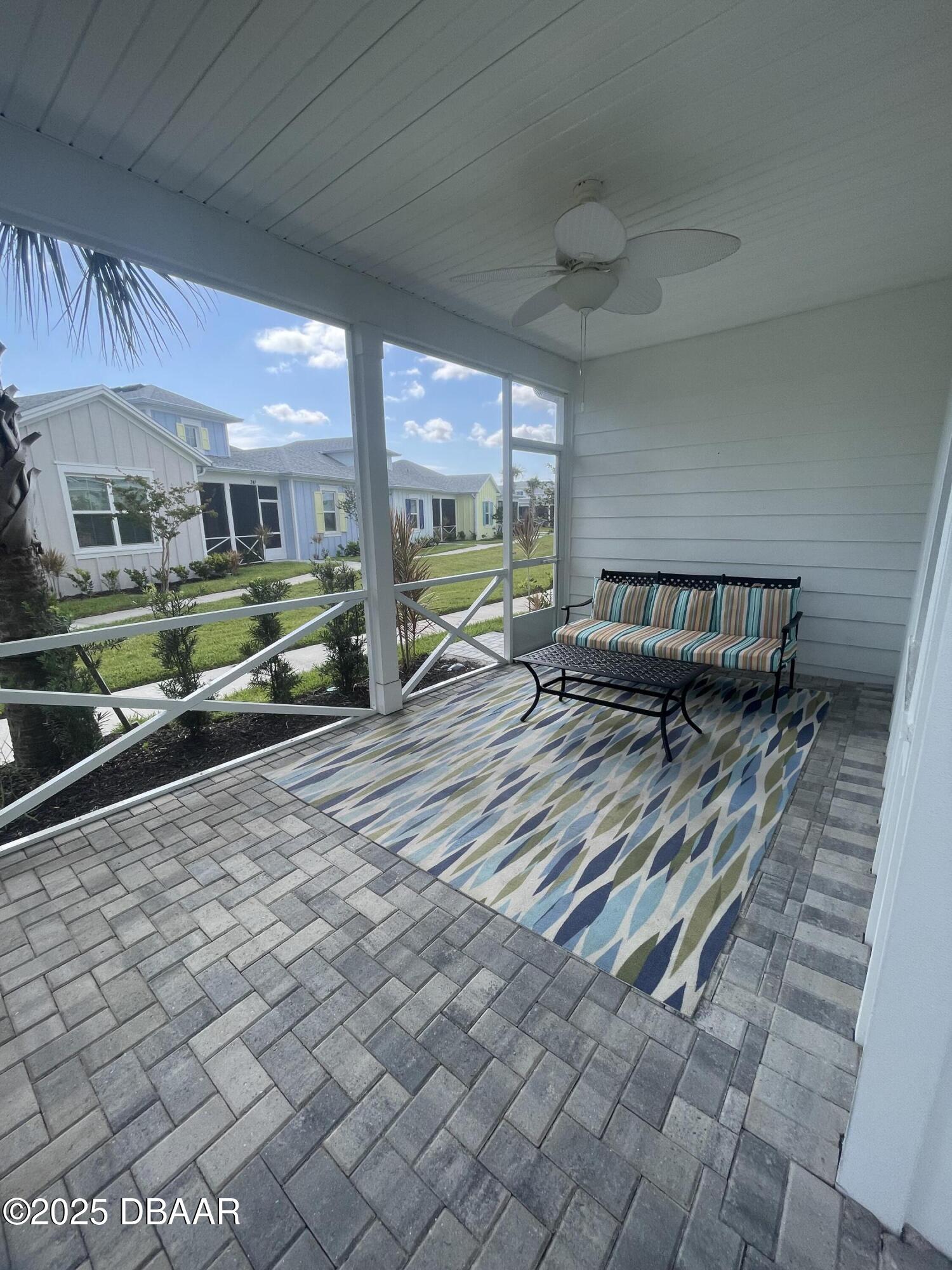 231 Ocean Hammock Loop Daytona Beach, FL 32124 - Photo 5 of 39 a sitting area with furniture and a rug