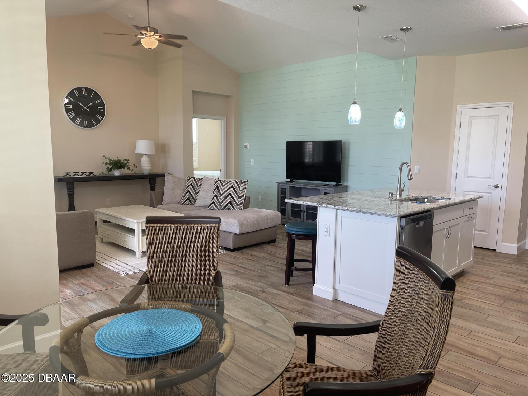231 Ocean Hammock Loop Daytona Beach, FL 32124 - Photo 8 of 39 a living room with furniture a rug and a fireplace