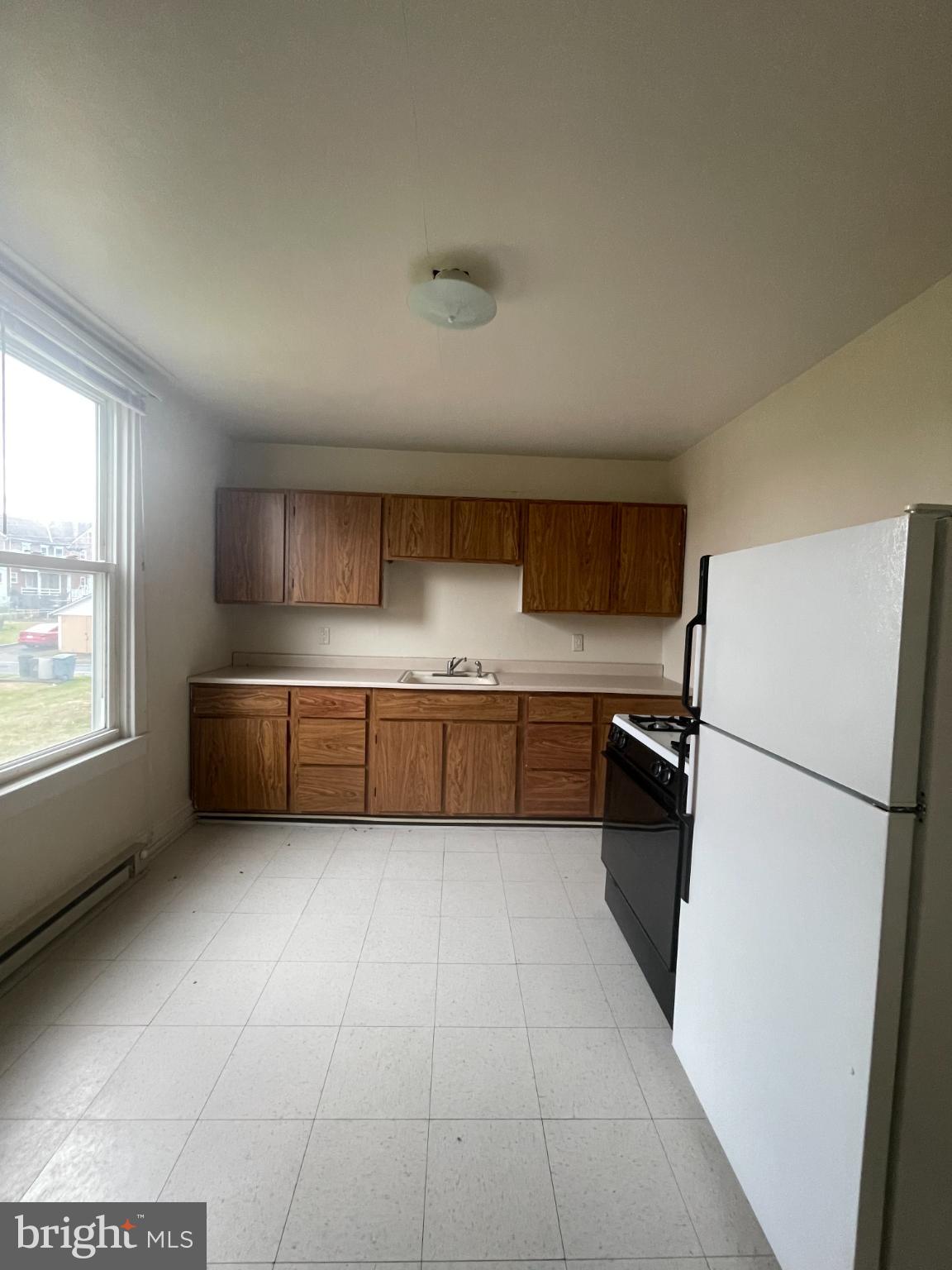 452 West 1st Street, Unit 5 Birdsboro, PA 19508 - Photo 5 of 10 a kitchen with a cabinets and white appliances