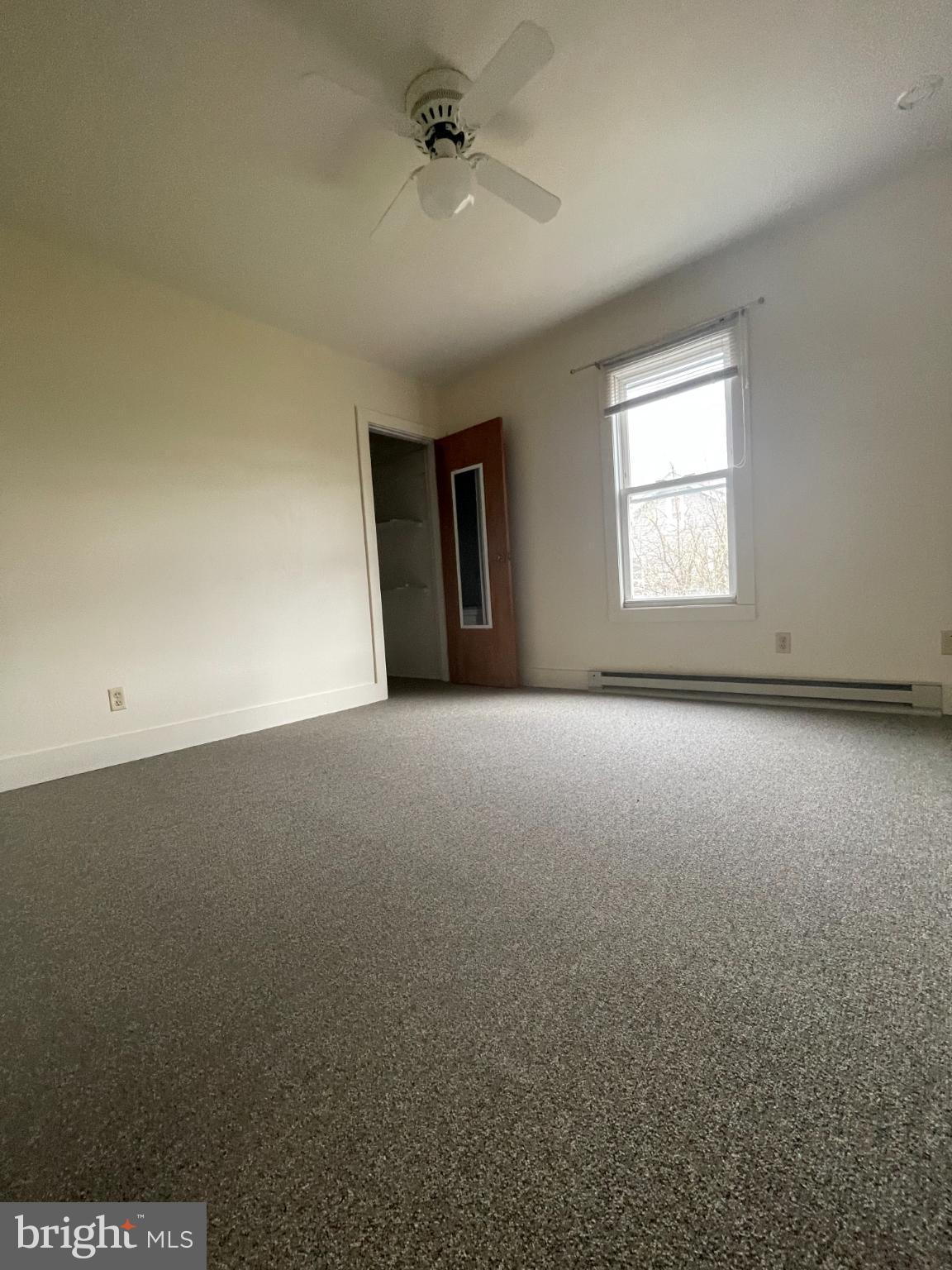 452 West 1st Street, Unit 5 Birdsboro, PA 19508 - Photo 9 of 10 an empty room with a empty space and windows