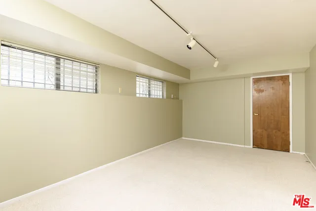 a bathroom with a sink double vanity and a mirror