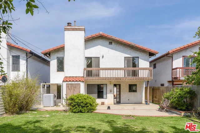 a front view of a house with a yard and porch