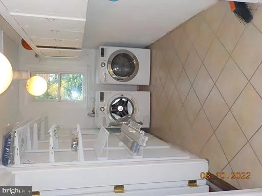 a close view of utility room with washer and dryer