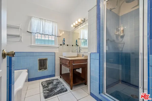 a spacious bathroom with a sink a toilet and shower