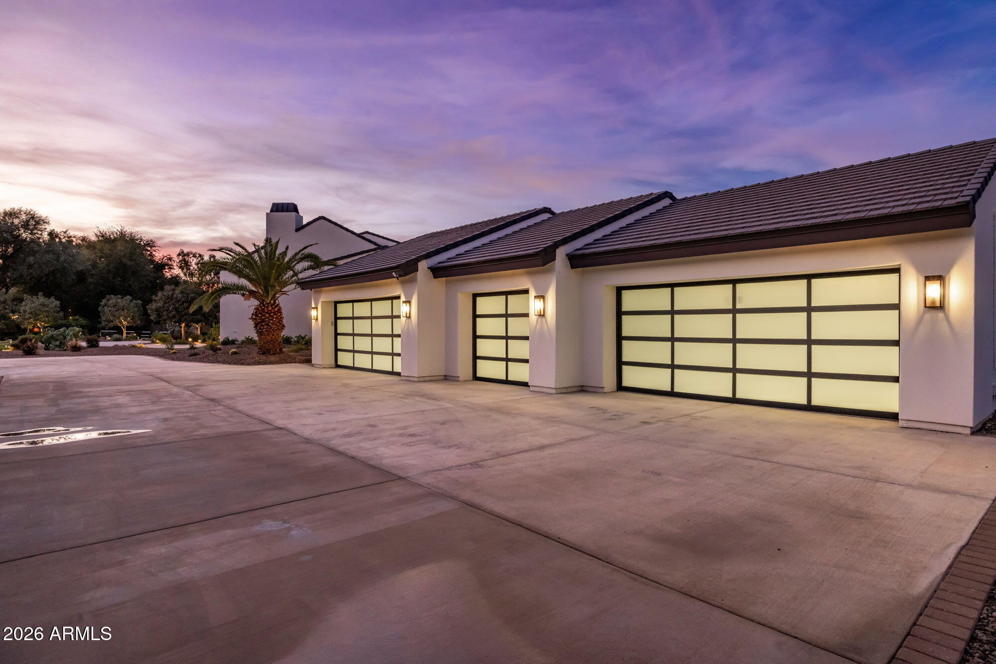 8625 Morning Glory Road Paradise Valley, AZ 85253 - Photo 11 of 52 a view of a house with a yard and garage