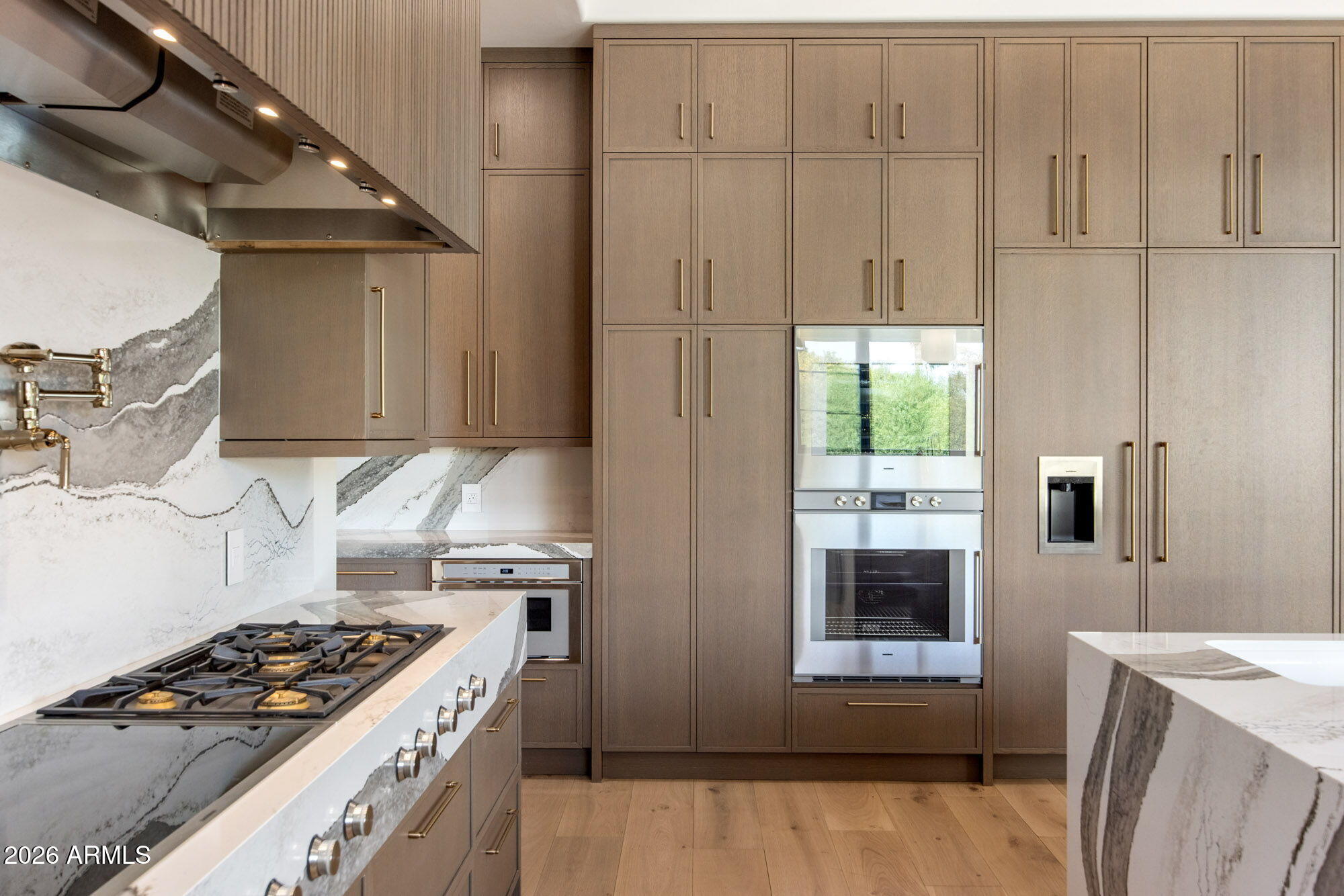 8625 Morning Glory Road Paradise Valley, AZ 85253 - Photo 17 of 52 a kitchen with granite countertop a stove and a refrigerator