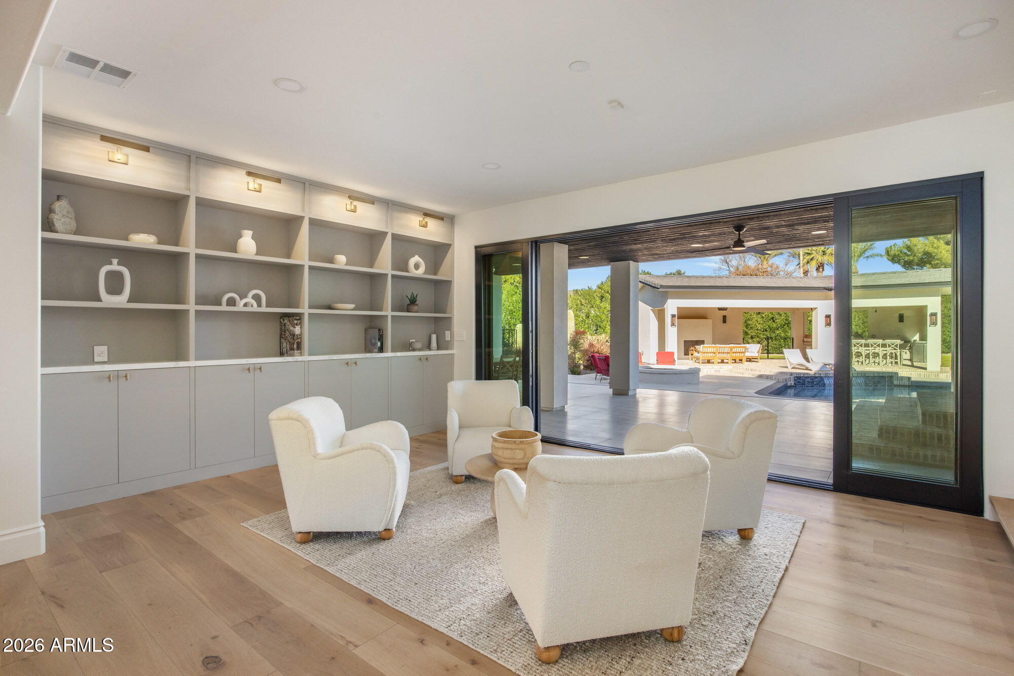 8625 Morning Glory Road Paradise Valley, AZ 85253 - Photo 20 of 52 a living room with furniture and a large window