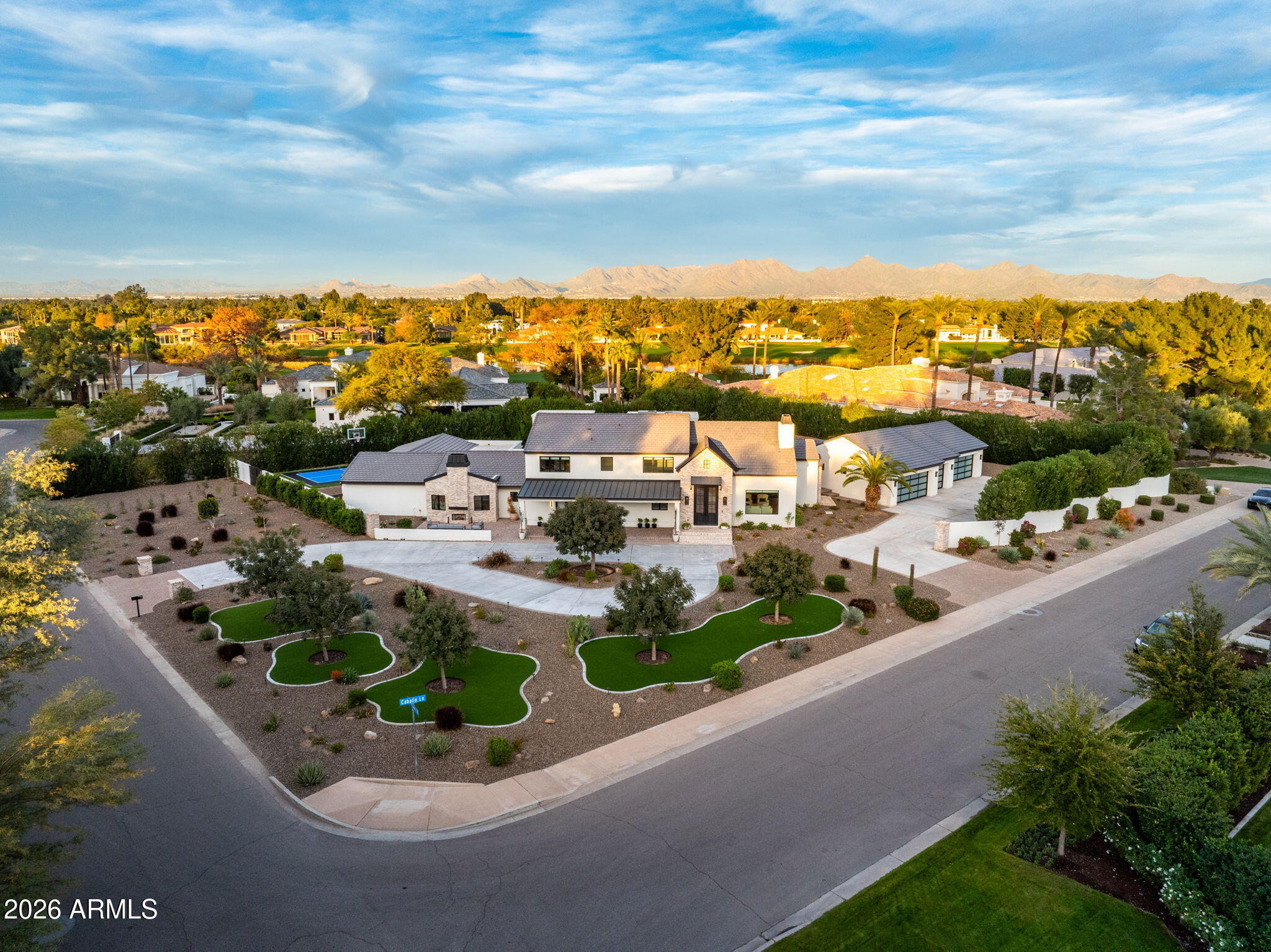 8625 Morning Glory Road Paradise Valley, AZ 85253 - Photo 2 of 52 a view of a lake with a garden