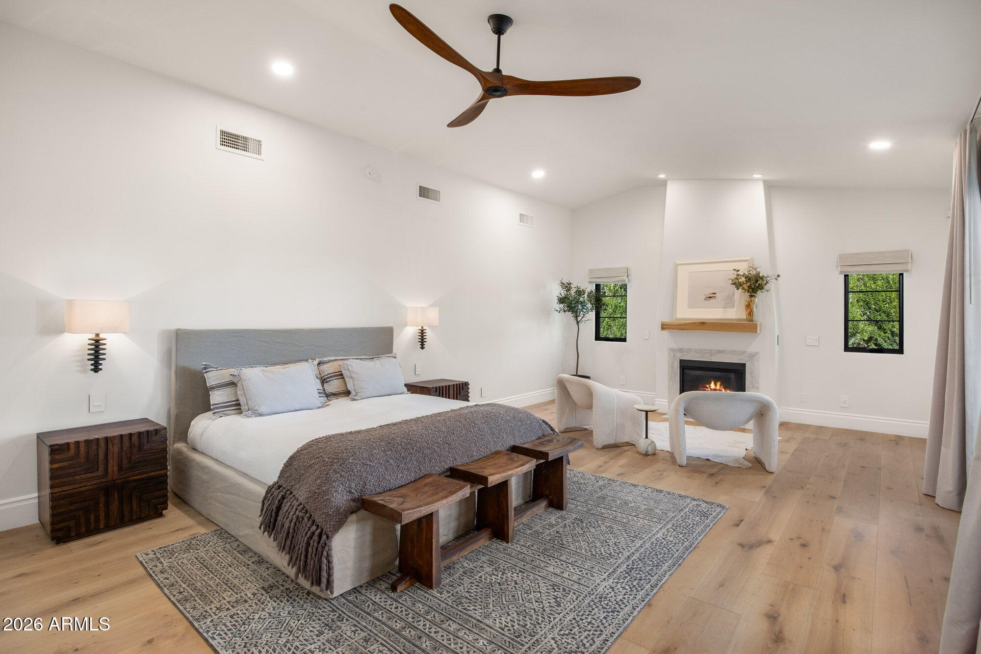 8625 Morning Glory Road Paradise Valley, AZ 85253 - Photo 21 of 52 a bedroom with a bed a couch and a window