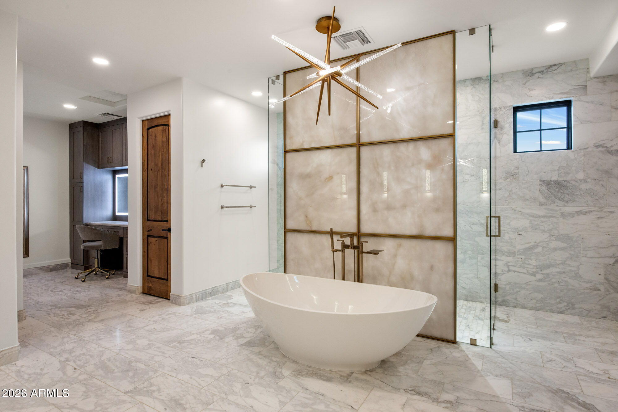 8625 Morning Glory Road Paradise Valley, AZ 85253 - Photo 25 of 52 a bathroom with a bathtub and a shower