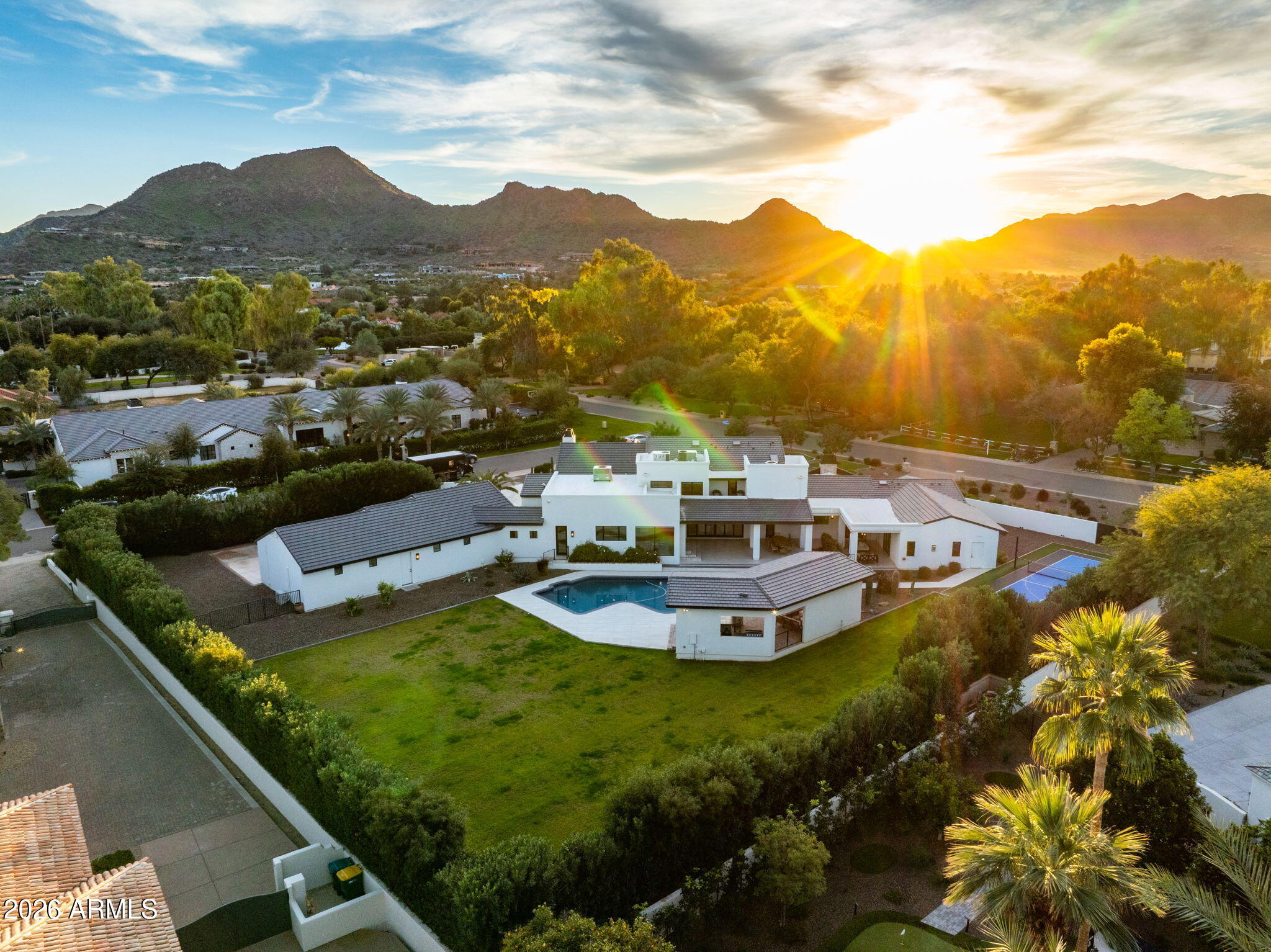 8625 Morning Glory Road Paradise Valley, AZ 85253 - Photo 3 of 52 a view of a swimming pool with a mountain