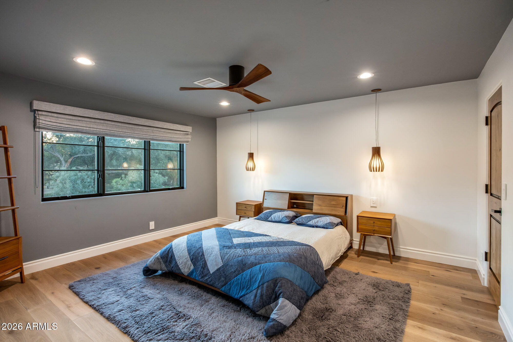 8625 Morning Glory Road Paradise Valley, AZ 85253 - Photo 34 of 52 a bedroom with a large bed and a window