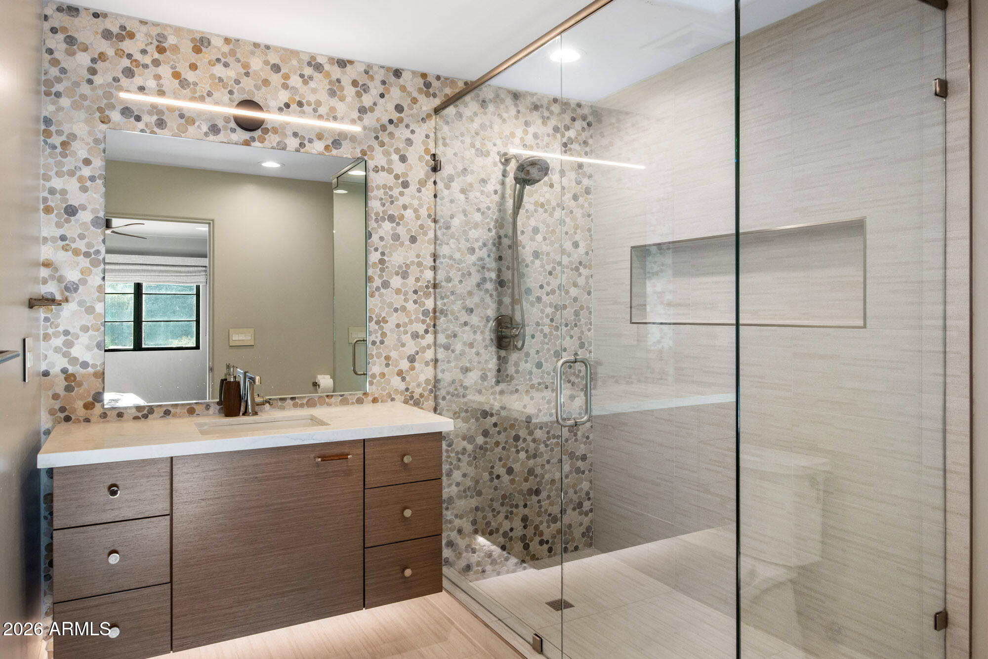 8625 Morning Glory Road Paradise Valley, AZ 85253 - Photo 35 of 52 a bathroom with a double vanity sink mirror and shower