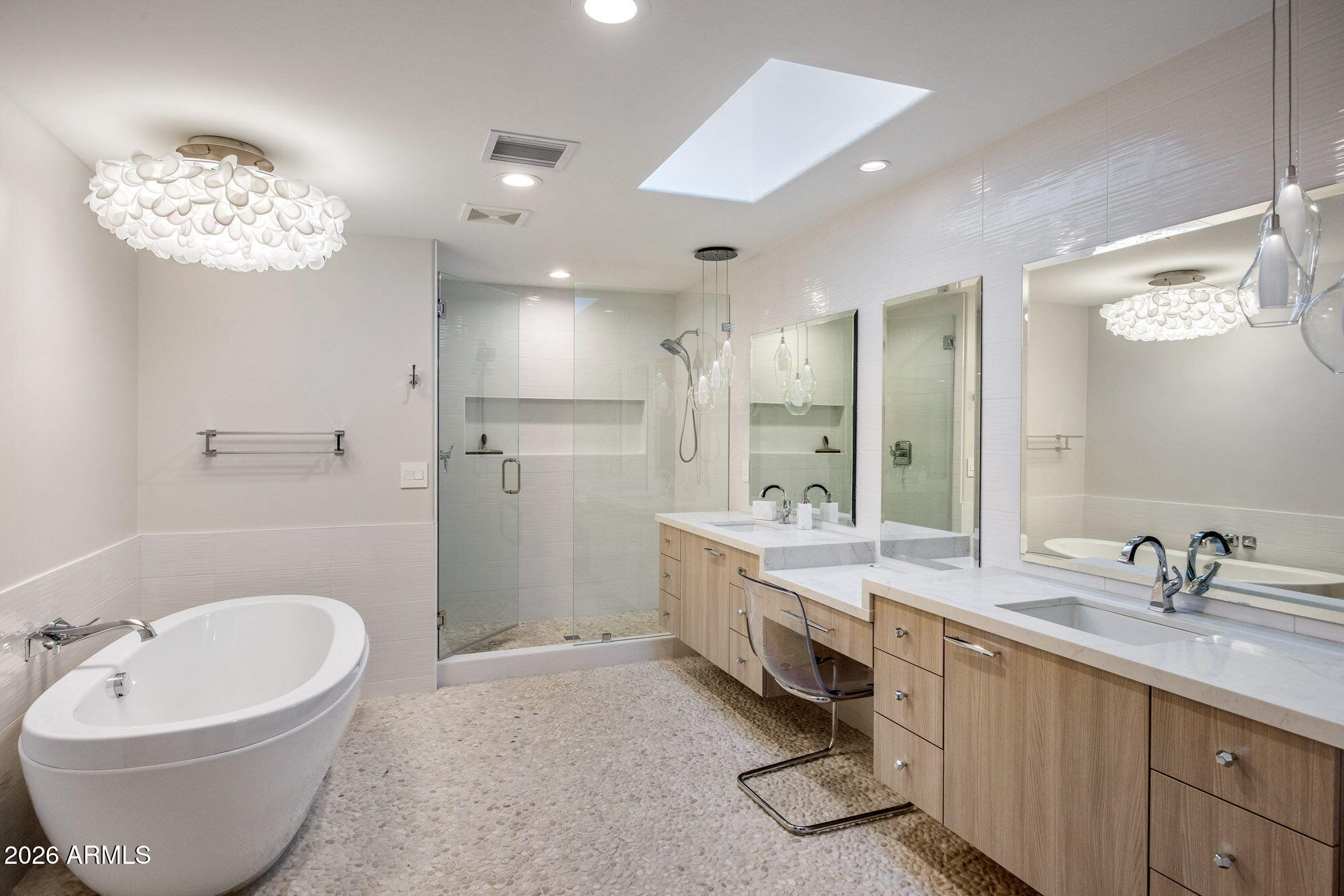 8625 Morning Glory Road Paradise Valley, AZ 85253 - Photo 37 of 52 a bathroom with a double vanity sink a mirror and a bathtub