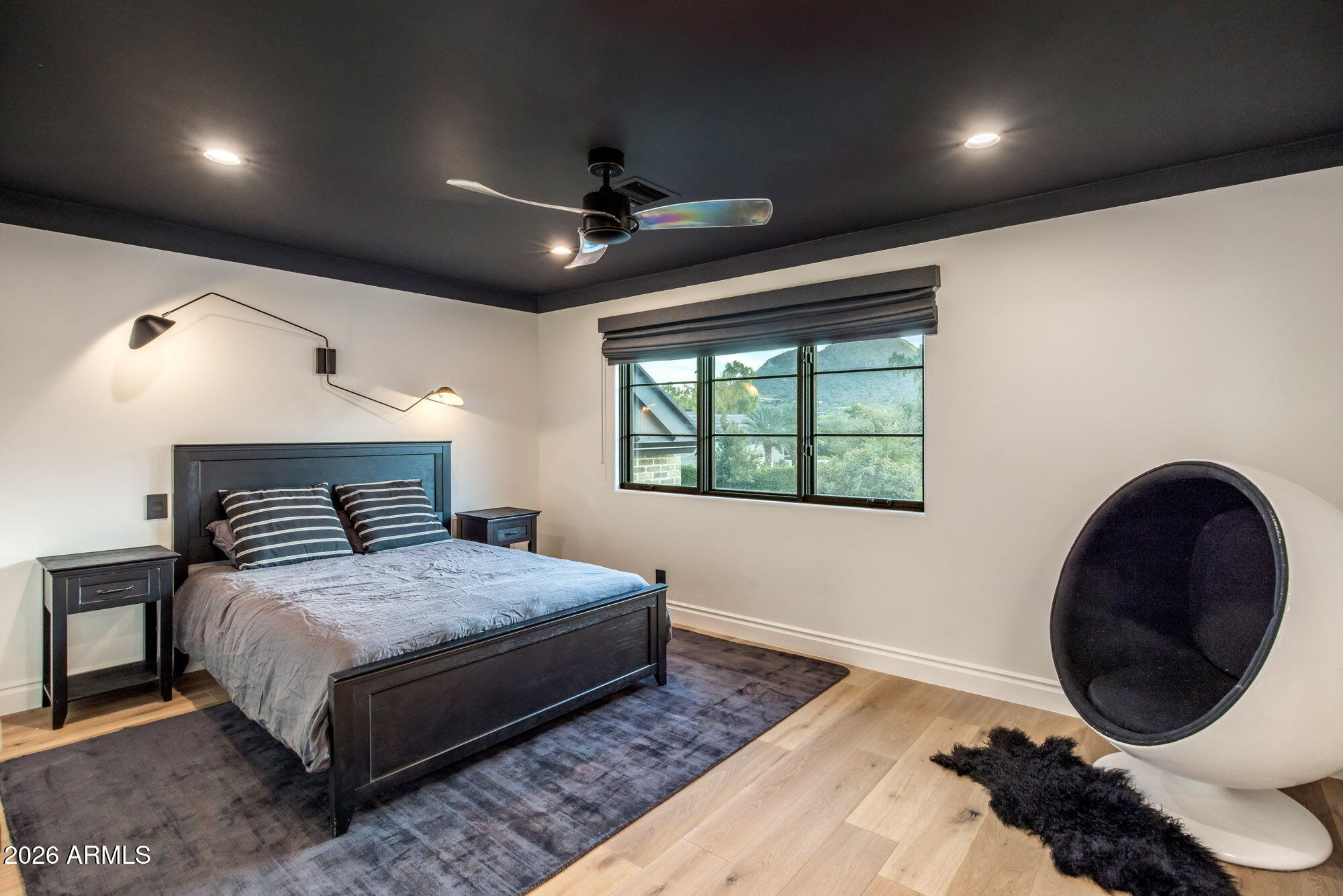 8625 Morning Glory Road Paradise Valley, AZ 85253 - Photo 40 of 52 a bedroom with a bed and a large window