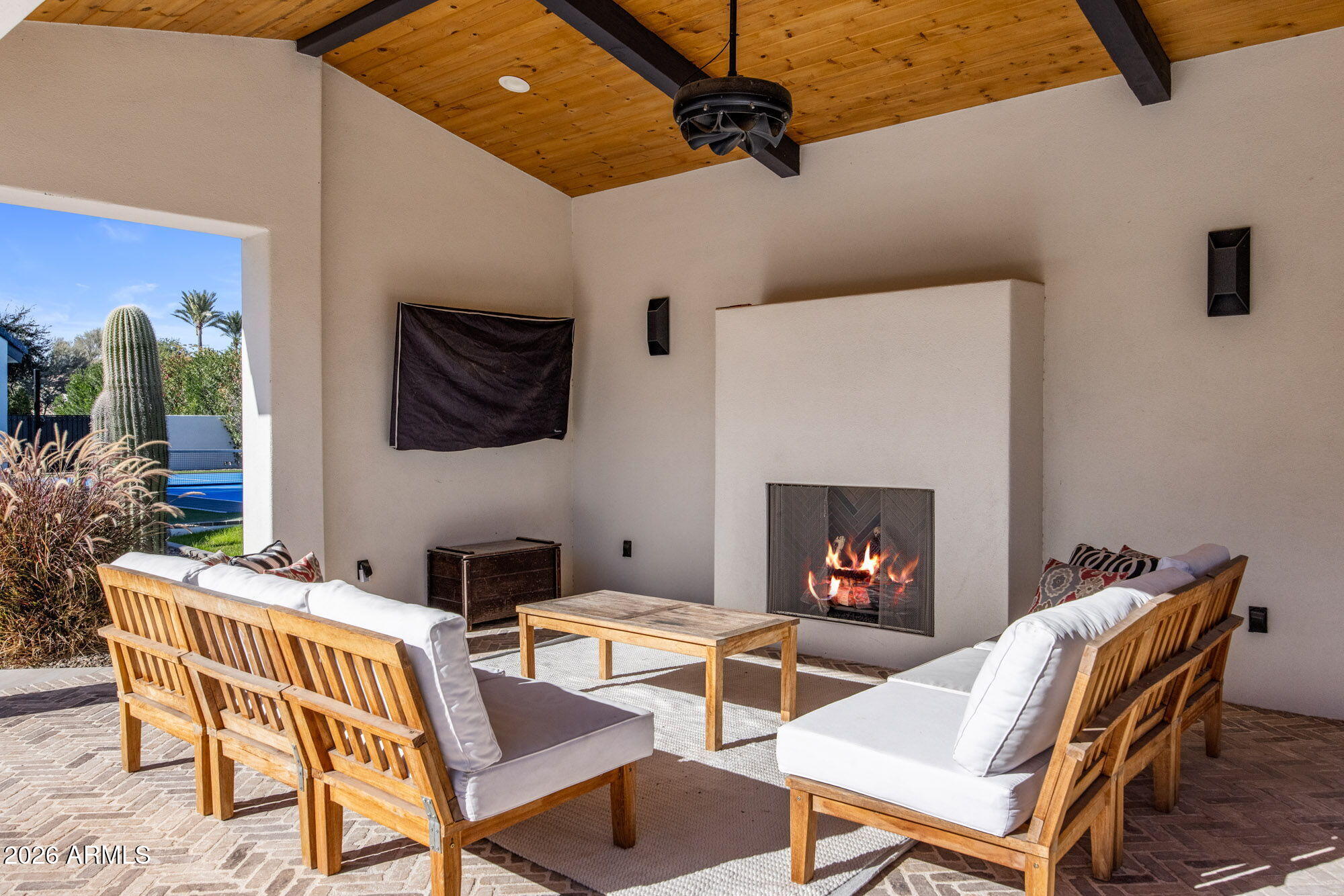 8625 Morning Glory Road Paradise Valley, AZ 85253 - Photo 46 of 52 a living room with furniture and a fireplace