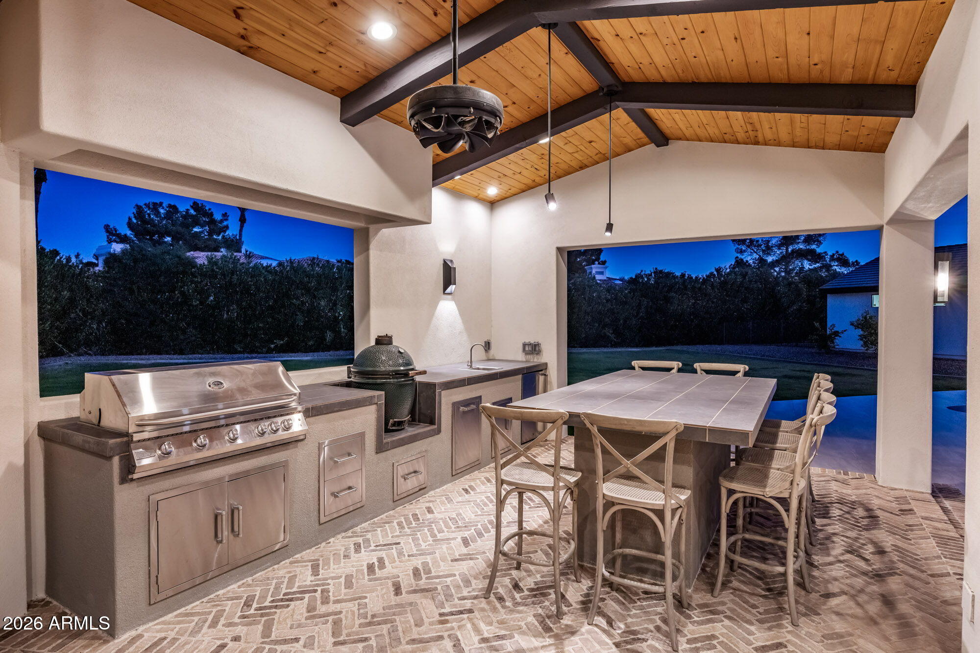 8625 Morning Glory Road Paradise Valley, AZ 85253 - Photo 47 of 52 a open kitchen with stainless steel appliances kitchen island granite countertop a stove a sink and a microwave