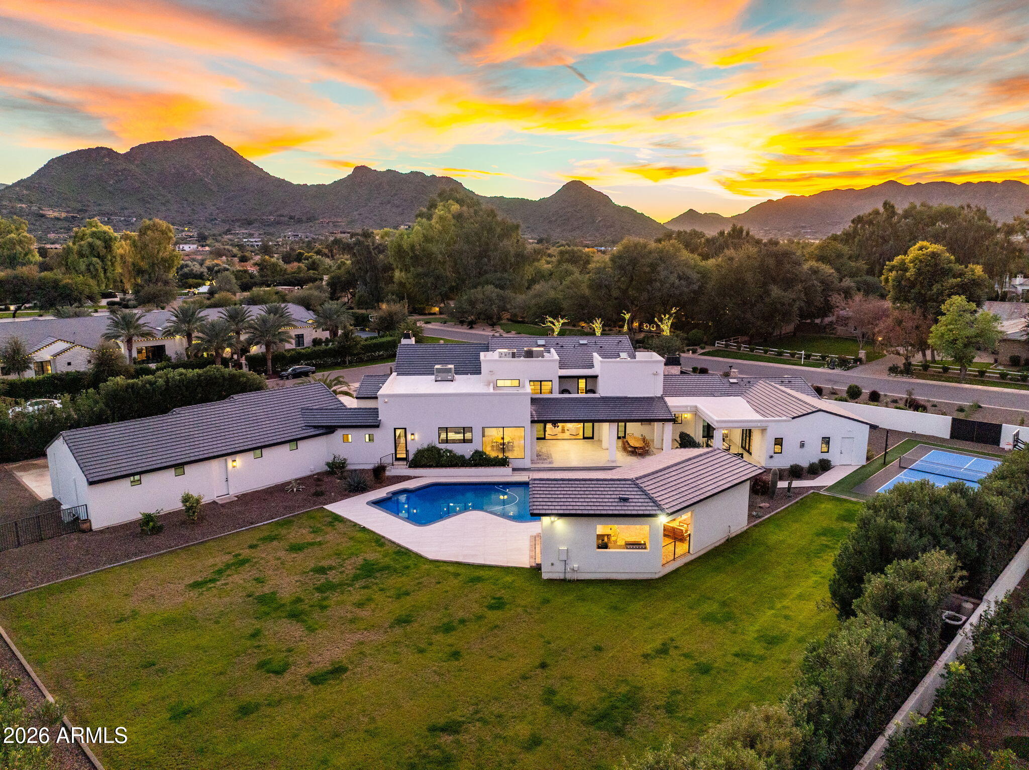 8625 Morning Glory Road Paradise Valley, AZ 85253 - Photo 52 of 52 a view of a swimming pool with a garden and mountain view