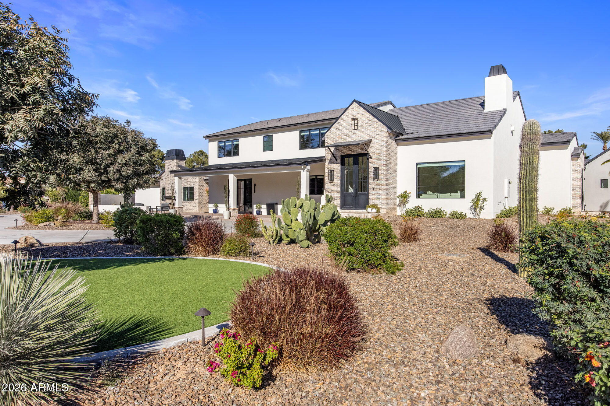 8625 Morning Glory Road Paradise Valley, AZ 85253 - Photo 6 of 52 a front view of a house with a yard
