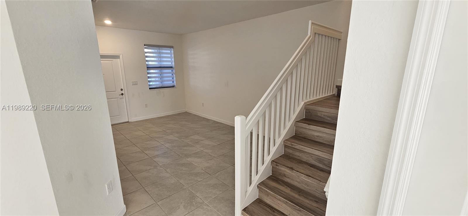 28708 Southwest 134th Court Homestead, FL 33033 - Photo 12 of 26 a view of entryway and hall with wooden floor