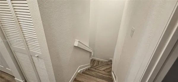 a view of a bathroom from a corridor