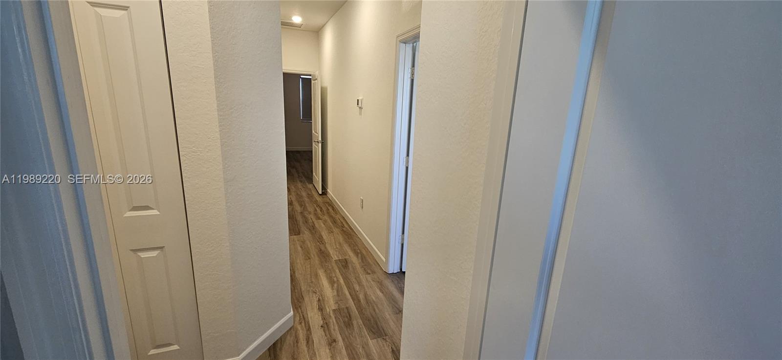 28708 Southwest 134th Court Homestead, FL 33033 - Photo 14 of 26 a view of a bathroom from a corridor