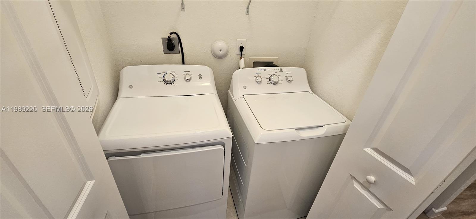 28708 Southwest 134th Court Homestead, FL 33033 - Photo 15 of 26 a utility room with dryer and washer