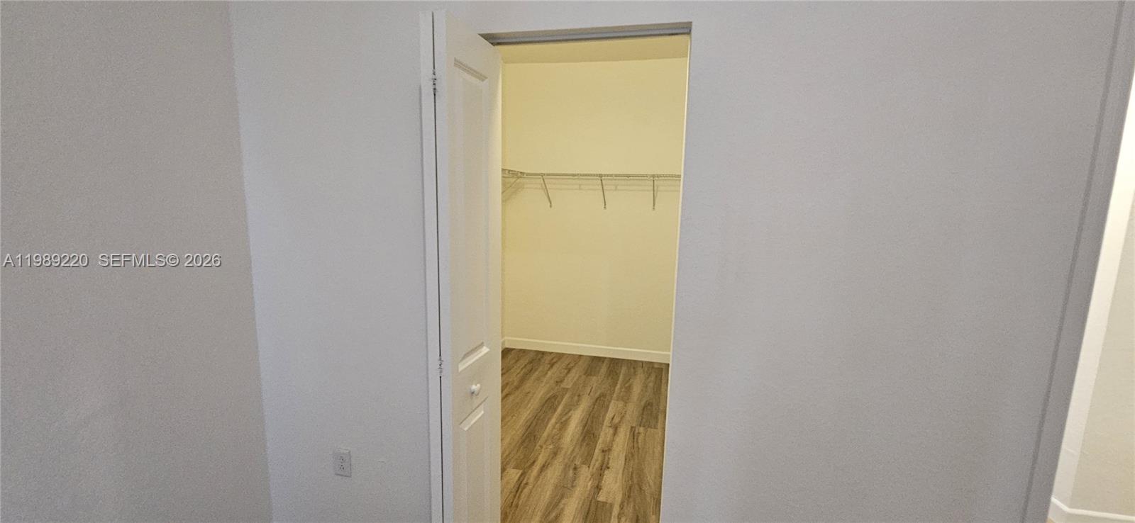 28708 Southwest 134th Court Homestead, FL 33033 - Photo 18 of 26 a view of an entryway with wooden floor