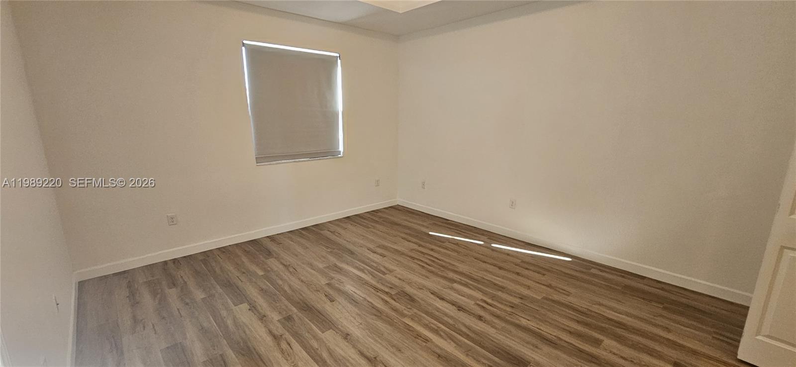 28708 Southwest 134th Court Homestead, FL 33033 - Photo 20 of 26 a view of wooden floor in a room