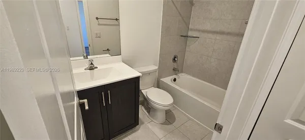 a bathroom with a double vanity sink and mirror