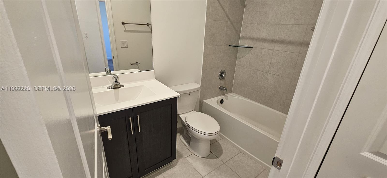 28708 Southwest 134th Court Homestead, FL 33033 - Photo 23 of 26 a bathroom with a sink toilet and shower