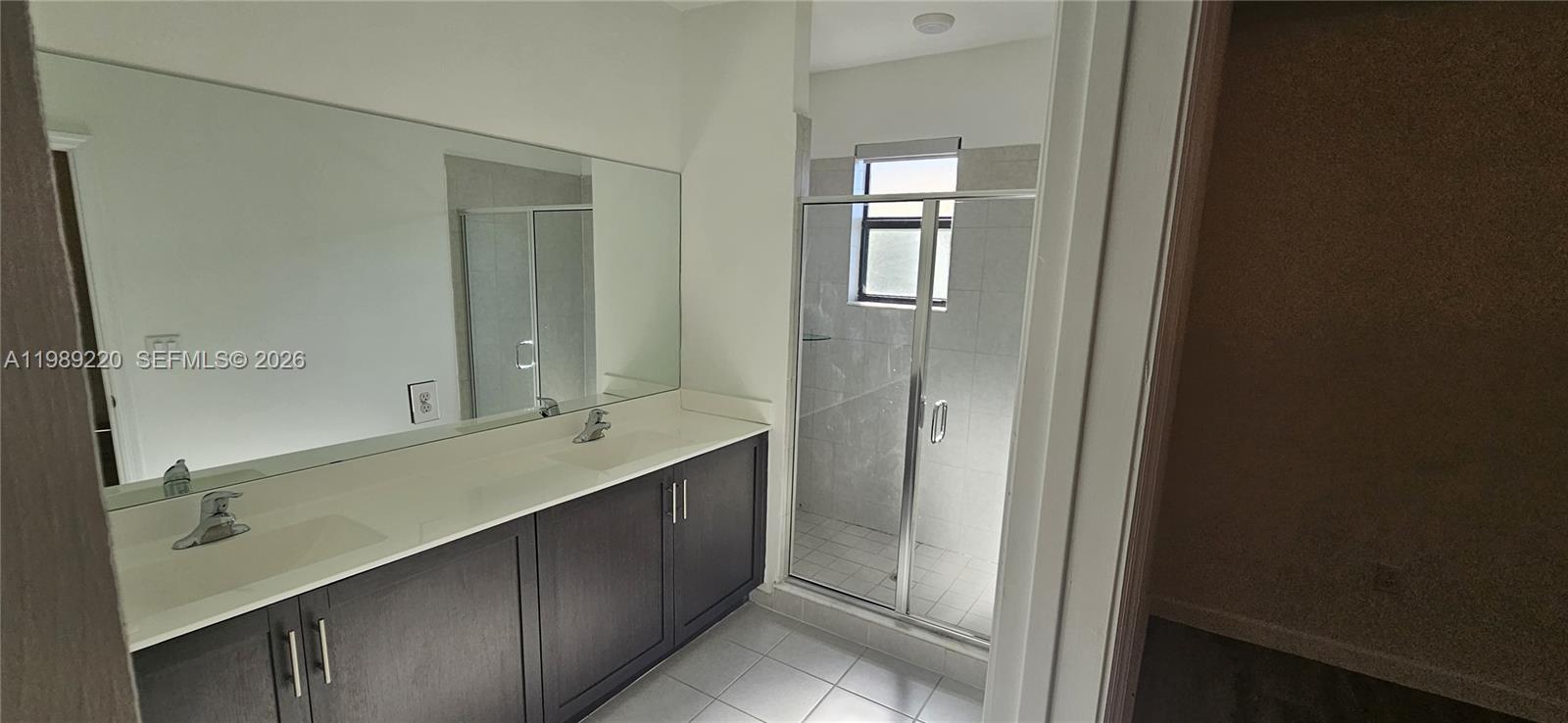 28708 Southwest 134th Court Homestead, FL 33033 - Photo 25 of 26 a bathroom with a double vanity sink and mirror