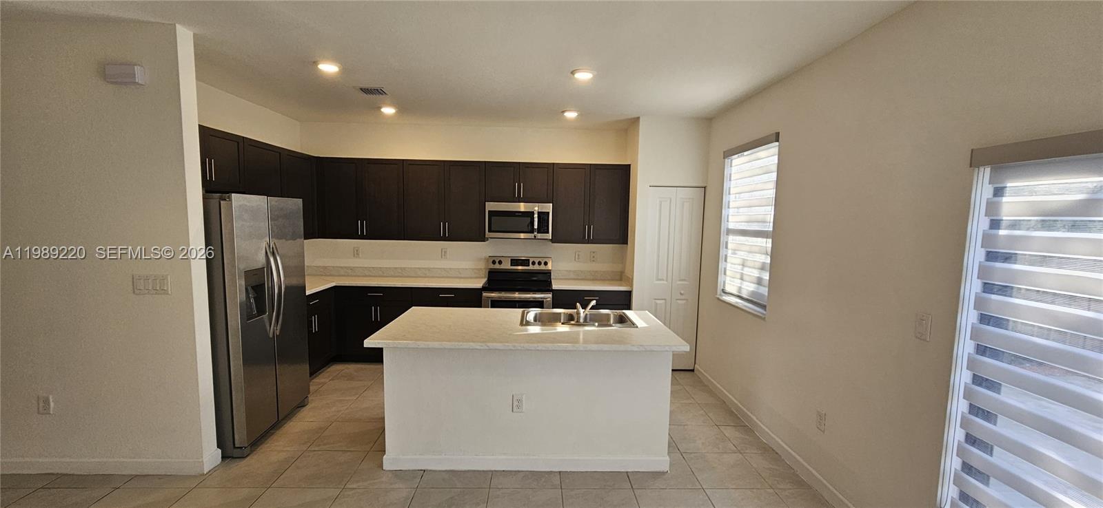 28708 Southwest 134th Court Homestead, FL 33033 - Photo 6 of 26 a utility room with washer and dryer
