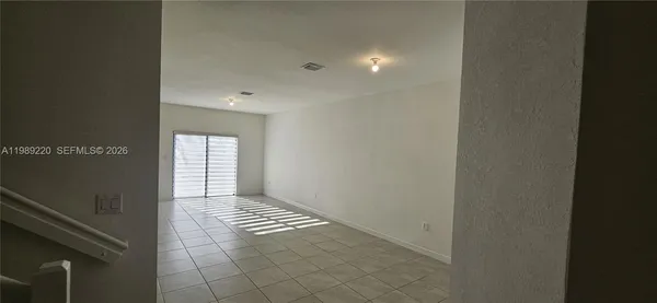 a view of a livingroom and a hallway