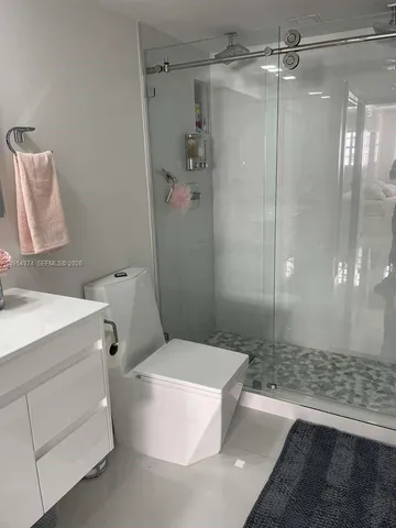 a bathroom with a double vanity sink and mirror