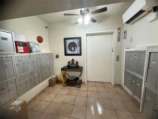 a kitchen with stainless steel appliances kitchen island granite countertop a stove a sink and a refrigerator