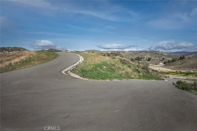 a view of a road with a yard