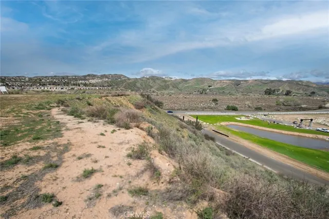 a view of an ocean beach and mountain