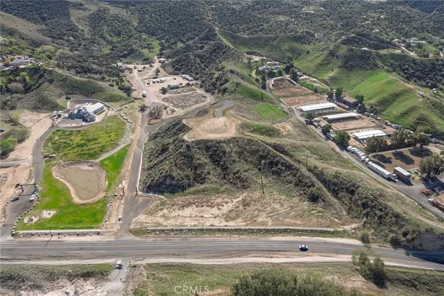 a view of a yard with a wooden fence