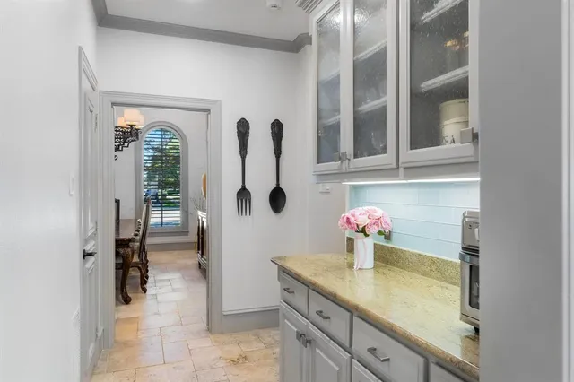a bathroom with a sink vanity and mirror