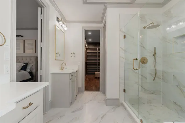 a bathroom with a shower sink and mirror