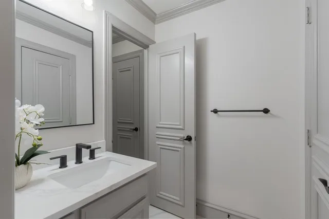 a bathroom with a sink vanity and a mirror