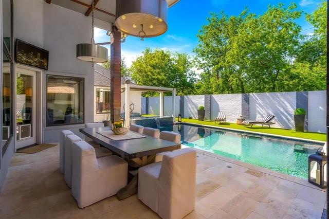 a view of a patio with a table and chairs